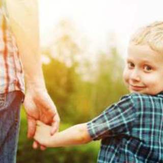 Child holding father's hand