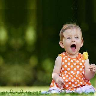 Baby girl sitting outside