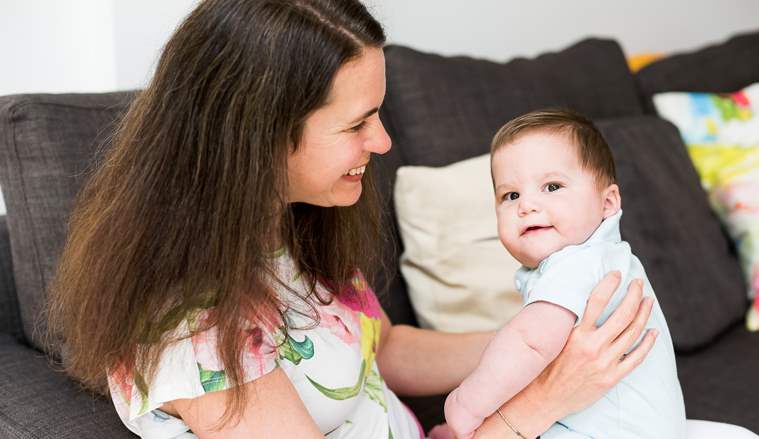 Amanda and baby on sofa